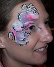Carmen Tellez face paints Kim manager of Damon's Grill in South Bend Indiana